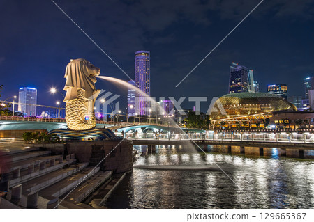 Illuminated Merlion statue at night in Merlion Park, Singapore Illuminated Merlion statue at night in Merlion Park, Singapore 129665367