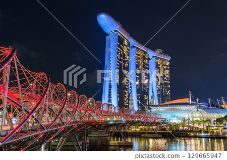 Marina Bay Sands and Helix Bridge at night in Singapore 129665947