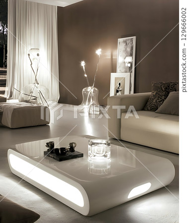 A living room with a white coffee table and a couch A living room with a white coffee table and a couch 129666002