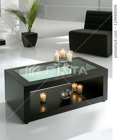 A black coffee table with a glass top and a shelf underneath 129666006