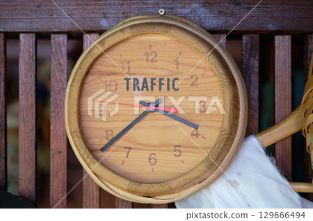 Smart city digital transformation development concept. Copy space. TRAFFIC word written on Wooden wall clock 129666494
