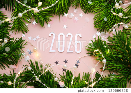 New Year 2026 pink background. Number of the coming year in Christmas decoration. 129666838
