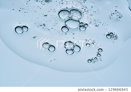 Beautiful swatch of shower gel on a blue background. View from below. 129666843