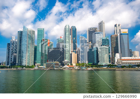 Singapore: Marina Bay and Downtown Core skyscrapers against the blue sky 129666990