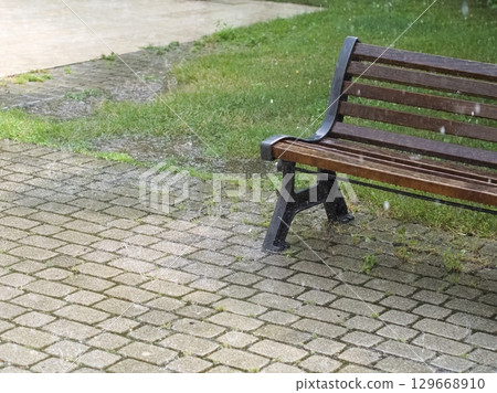 Park Bench in the Rain Park Bench in the Rain 129668910