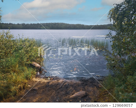 A large beautiful lake. The water is calm and clean. 129669057
