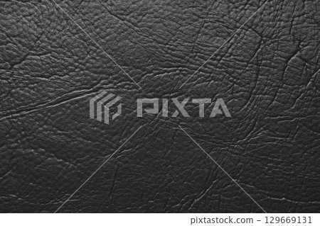 Close up, macro texture of black glossy natural genuine leather, leatherette structure Close up, macro texture of black glossy natural genuine leather, leatherette structure 129669131