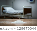 Sugar pile on floor in hospital room highlighting health risks of excessive consumption 129670044