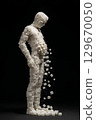 Abstract sculpture of a human figure made from sugar cubes, illustrating the harmful effects of sugar 129670050
