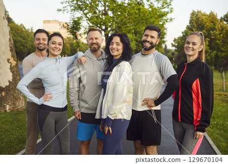 Group Portrait Of Happy Team At Outdoor Workout Group Portrait Of Happy Team At Outdoor Workout 129670104