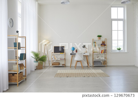 Big children's room with a desk, shelves, chalkboard, plants, books, toys and rug Big children's room with a desk, shelves, chalkboard, plants, books, toys and rug 129670673