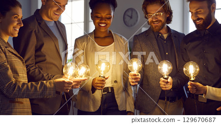 Team of business people with light bulbs work together and develop creative ideas 129670687