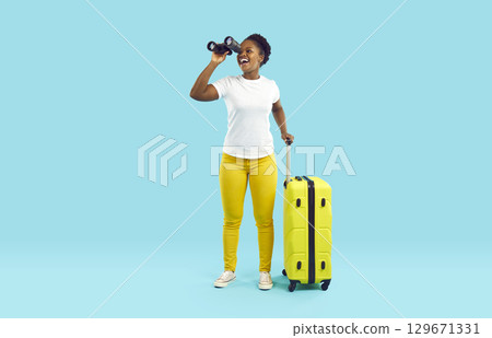 Happy female traveler with suitcase and binoculars looking for best bargain travel tours. Happy female traveler with suitcase and binoculars looking for best bargain travel tours. 129671331