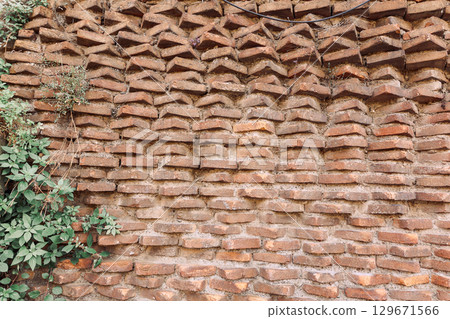 Wall of old red bricks with unusual masonry in Rome, Italy. High quality photo Wall of old red bricks with unusual masonry in Rome, Italy. High quality photo 129671566