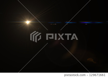 Lens flare, light effect on black. 129671661