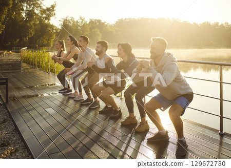 Join us for energizing Group Fitness Training at Sunrise by the beautiful Water 129672780