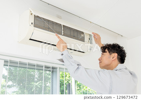 Air conditioner inspection worker 129673472