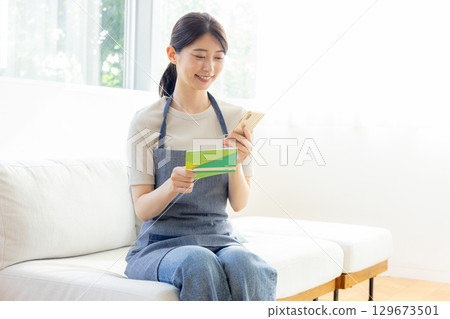 Bankbook smiling woman 129673501
