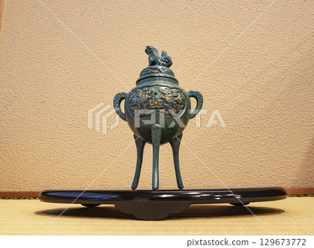 Incense burner displayed in the alcove 129673772