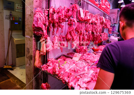 Pork sold at a butcher shop in the Hong Kong market. Higher and more expensive than beef and chicken. Chinese love pork Pork sold at a butcher shop in the Hong Kong market. Higher and more expensive than beef and chicken. Chinese love pork 129675369