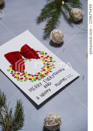 Christmas wreath Gift Christmas idea. Do it yourself instruction postcard eco-friendly decoration. Making handmade presents children's diy projects. Holiday family time 129675439