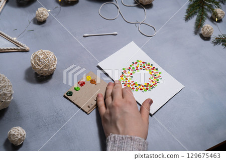 Christmas wreath Sustainable Christmas preparation Diy process of making handmade greeting cards. Step by step activity for children. Inclusive and responsible stress relief holiday hobby Christmas wreath Sustainable Christmas preparation Diy process of making handmade greeting cards. Step by step activity for children. Inclusive and responsible stress relief holiday hobby 129675463