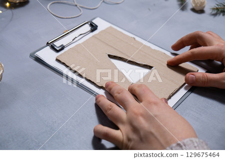 Christmas tree Gift Christmas idea. Do it yourself instruction postcard eco-friendly decoration. Making handmade presents children's diy projects. Holiday family time 129675464