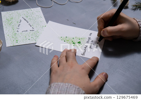 Christmas tree Storytelling of creating craft Christmas greeting card holiday present. Tactile hand-on activity. Master class progress of creative me-made gifts. Seasonal domestic life micro moment Christmas tree Storytelling of creating craft Christmas greeting card holiday present. Tactile hand-on activity. Master class progress of creative me-made gifts. Seasonal domestic life micro moment 129675469