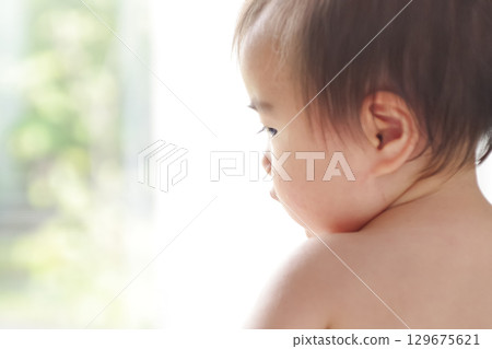 An innocent baby wrapped in light An innocent baby wrapped in light 129675621