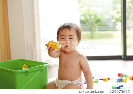 Infants and toddlers fascinated by educational toys 129675625