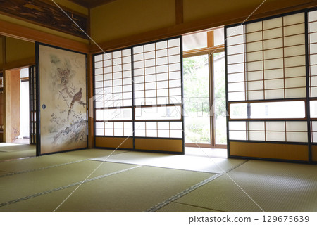 Tatami-floored room and beautiful shoji screens in a Japanese house Tatami-floored room and beautiful shoji screens in a Japanese house 129675639