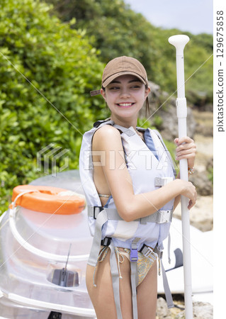 Cute woman enjoying SUP 129675858