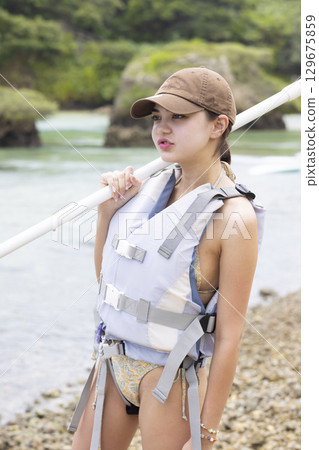 Cute woman enjoying SUP Cute woman enjoying SUP 129675859