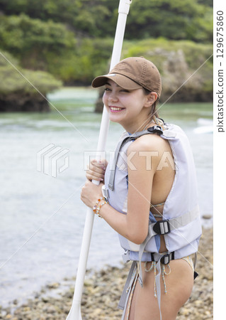Cute woman enjoying SUP 129675860