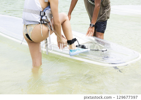 Cute woman enjoying SUP Cute woman enjoying SUP 129677397