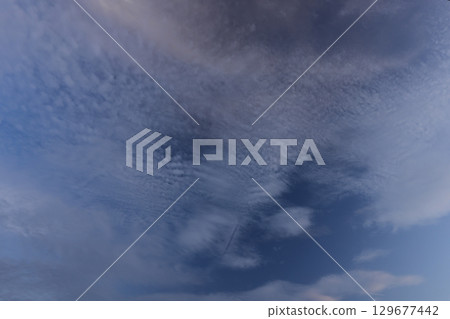Weather: Altocumulus clouds, wave-like clouds, mid-August. Ripple-like clouds spreading across the sky, contrails disappearing below the center Weather: Altocumulus clouds, wave-like clouds, mid-August. Ripple-like clouds spreading across the sky, contrails disappearing below the center 129677442