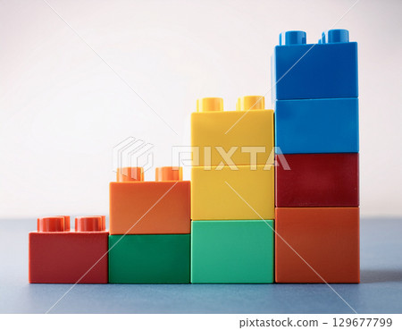 A bar graph made of colorful building blocks 129677799