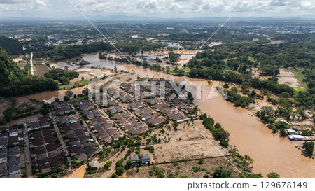 Aerial view of housing estate in suburb of Chiang Rai province flooded by Kok river rising after heavy rain. Chiang Rai hit by flash floods and runoff after overnight rain. Aerial view of housing estate in suburb of Chiang Rai province flooded by Kok river rising after heavy rain. Chiang Rai hit by flash floods and runoff after overnight rain. 129678149