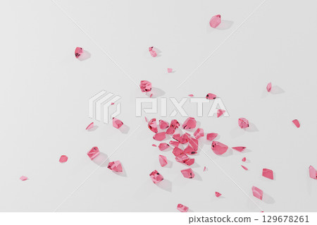 Red glass shards scattered on the floor 129678261