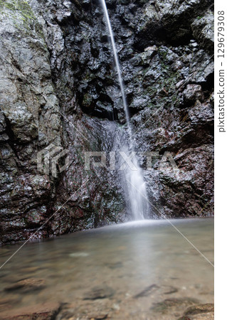 Landscape with a waterfall 129679308