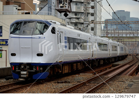 281 series Kansai Airport Express Haruka No. 16 running on the Osaka Loop Line 129679747