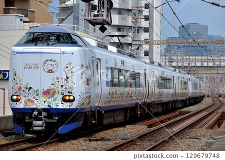 271 series Kansai Airport Express Haruka No. 23 running on the Osaka Loop Line 271 series Kansai Airport Express Haruka No. 23 running on the Osaka Loop Line 129679748