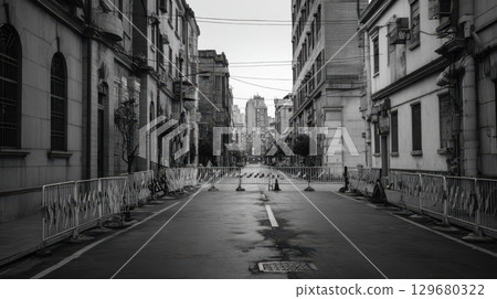 Empty street, quarantine zone, barricade, urban, city, deserted, overcast mood 129680322