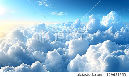 Aerial view of a sea of fluffy cumulus clouds under a bright blu 129681263
