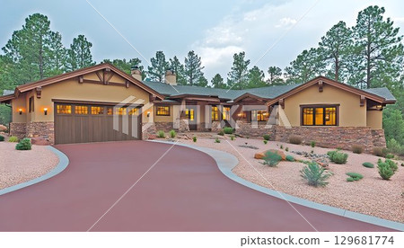 Southwestern Home with Stone Accents, Red Driveway, and Desert L 129681774