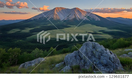 Majestic Mountain Range at Sunset with Lush Valley and Rocky Out Majestic Mountain Range at Sunset with Lush Valley and Rocky Out 129681877