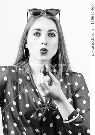 Retro style woman portrait with strawberry 129682460
