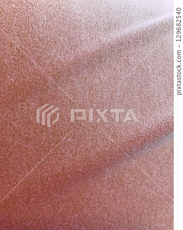 Shiny drape curtain wrinkled red soft cloth texture fabric background material 129682540