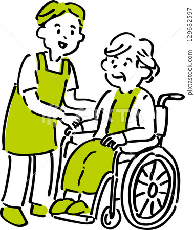 Smiling interaction between an elderly person in a wheelchair and a caregiver 129682597