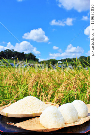 Autumn rice field and bowl of rice balls Autumn rice field and bowl of rice balls 129683056